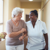 senior woman holding the hand of caregiver