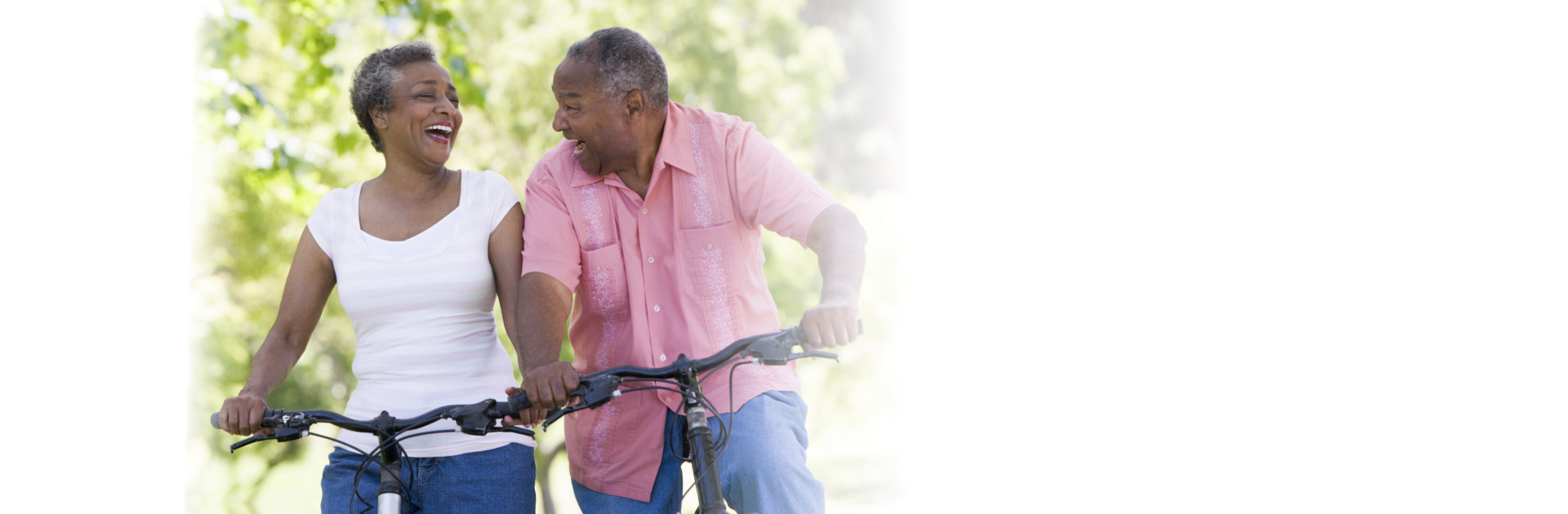 happy seniors riding a bicycle